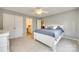 Cozy bedroom with neutral colors, a double bed, and views into the ensuite bathroom at 6458 Chadwell Ct # 30, Indian Land, SC 29707