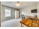 Bedroom with a large window, wood desk, TV and storage at 6458 Chadwell Ct # 30, Indian Land, SC 29707