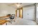 Spacious bedroom with neutral carpet, ceiling fan, large closet, and a dedicated office space at 6458 Chadwell Ct # 30, Indian Land, SC 29707