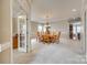 Spacious dining room with large table and seating for 10, carpeted floor, neutral walls, and modern chandelier at 6458 Chadwell Ct # 30, Indian Land, SC 29707