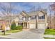 Traditional two-story home with three-car garage and well-manicured front yard at 6458 Chadwell Ct # 30, Indian Land, SC 29707