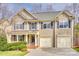 Beautiful two-story home featuring a well-manicured lawn, attached two-car garage and charming front porch area at 6458 Chadwell Ct # 30, Indian Land, SC 29707