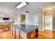 Spacious kitchen featuring a large island with granite countertops and hardwood floors at 6458 Chadwell Ct # 30, Indian Land, SC 29707