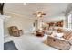 Open concept living room has neutral walls, carpet and furniture with access to the kitchen at 6458 Chadwell Ct # 30, Indian Land, SC 29707