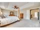 Bright main bedroom with a ceiling fan, neutral walls, and a view into the adjacent living space at 6458 Chadwell Ct # 30, Indian Land, SC 29707