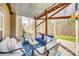 Relaxing outdoor patio with cushioned seating, a blue-patterned rug, and views of the lawn at 6458 Chadwell Ct # 30, Indian Land, SC 29707