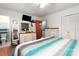 The primary bedroom has a TV, and a shared bathroom with a tiled shower-tub, and a large closet at 662 University Dr, Rock Hill, SC 29730