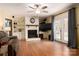 Cozy living room with a fireplace, built-in shelving, and french doors leading to the outside at 662 University Dr, Rock Hill, SC 29730