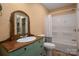 Bathroom with a tub and shower and a charming old fashioned vanity at 7512 Walkup Rd, Waxhaw, NC 28173