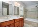 Bathroom with double vanity and a tub at 7512 Walkup Rd, Waxhaw, NC 28173
