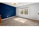 Carpeted bedroom with lots of natural light at 7512 Walkup Rd, Waxhaw, NC 28173