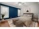 Bright, decorated bedroom featuring large windows and patterned bedding at 7512 Walkup Rd, Waxhaw, NC 28173