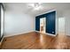 Large bedroom with hardwood floors and an ensuite bathroom at 7512 Walkup Rd, Waxhaw, NC 28173