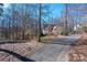 Exterior view of home showcasing front yard and long driveway at 7512 Walkup Rd, Waxhaw, NC 28173