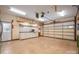 Spacious garage with storage cabinets, tool area, and an insulated garage door at 7512 Walkup Rd, Waxhaw, NC 28173