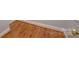 Close up of hardwood floor with white molding trim at 7512 Walkup Rd, Waxhaw, NC 28173