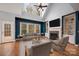 The living room is enhanced by natural light from the window, a fireplace, and comfortable seating for relaxing evenings at 7512 Walkup Rd, Waxhaw, NC 28173