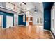 Large living room with hardwood floors, a loft, and big windows, creating the perfect atmosphere for Gathering time and gatherings at 7512 Walkup Rd, Waxhaw, NC 28173