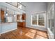 The large kitchen is complemented by hardwood floors and large windows that offer stunning natural light at 7512 Walkup Rd, Waxhaw, NC 28173