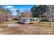 Cozy single-story home surrounded by lush greenery and a spacious, open yard at 8670 Carroll St, Hickory, NC 28601