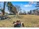 Spacious backyard featuring a brick firepit and mature trees creating a peaceful setting at 8670 Carroll St, Hickory, NC 28601