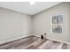 Bright bedroom featuring gray walls, wood-look floors, and a window with natural light at 8670 Carroll St, Hickory, NC 28601