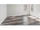 Empty bedroom with wood grain flooring and natural light from the window at 8670 Carroll St, Hickory, NC 28601