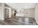 Open kitchen with sleek stainless steel appliances, white cabinets, and modern flooring at 8670 Carroll St, Hickory, NC 28601