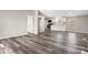 Bright, open-concept living space with modern wood-look floors and neutral wall colors at 8670 Carroll St, Hickory, NC 28601