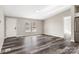 Well-lit living area with stylish floors, neutral tones, and seamless flow to adjacent rooms at 8670 Carroll St, Hickory, NC 28601