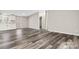 Open living space with updated flooring, neutral paint, and smooth transition into the kitchen at 8670 Carroll St, Hickory, NC 28601