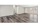 Bright, open living space with wood-look floors, white trim, and neutral gray walls at 8670 Carroll St, Hickory, NC 28601