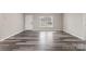 Spacious, light-filled living area with modern flooring and neutral paint for easy customization at 8670 Carroll St, Hickory, NC 28601