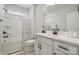 Clean bathroom with modern vanity, white cabinets, quartz countertop, and combined shower and tub at 9096 El Sworth Dr, Sherrills Ford, NC 28673