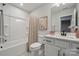 Bathroom with shower-tub combination, vanity with sink, and neutral paint at 9096 El Sworth Dr, Sherrills Ford, NC 28673