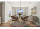 Bright dining room with a round table, stylish chairs, elegant lighting, and a view to the outside at 9096 El Sworth Dr, Sherrills Ford, NC 28673