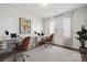 Bright office featuring two desks, modern chairs, neutral walls, and natural light from a large window at 9096 El Sworth Dr, Sherrills Ford, NC 28673