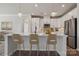Modern kitchen featuring stainless steel appliances, a spacious island, and stylish pendant lighting at 9096 El Sworth Dr, Sherrills Ford, NC 28673
