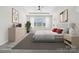 Spacious bedroom with tray ceiling, neutral tones, large windows, and tasteful decor creating a serene atmosphere at 9096 El Sworth Dr, Sherrills Ford, NC 28673