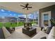 Relaxing screened-in patio with comfortable seating and views of the backyard at 9096 El Sworth Dr, Sherrills Ford, NC 28673