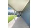 Covered back porch offers a relaxing outdoor space with blue siding and view of backyard at 9528 Pointer Rd # 63, Huntersville, NC 28078