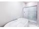 Modern bathroom with a standalone tub, large shower with glass doors, and marble-tiled floors at 9528 Pointer Rd # 63, Huntersville, NC 28078