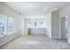 Bright upstairs bonus room features neutral carpet, lots of natural light, and modern finishes at 9528 Pointer Rd # 63, Huntersville, NC 28078