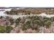 Breathtaking aerial view showcasing a lakeside community surrounded by lush forests and tranquil waters at 10031 Bora Bora Dr, Tega Cay, SC 29708