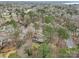 Beautiful aerial view of a home surrounded by a canopy of trees in a tranquil residential neighborhood at 10031 Bora Bora Dr, Tega Cay, SC 29708