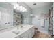Classic bathroom featuring vanity, decor, framed mirror, and tub shower at 10031 Bora Bora Dr, Tega Cay, SC 29708