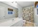 Well-lit bathroom featuring tile floors, a large mirror, and a neutral-patterned shower curtain at 10031 Bora Bora Dr, Tega Cay, SC 29708