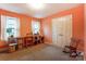 Bright bedroom features neutral carpet, desk, and ample natural light at 10031 Bora Bora Dr, Tega Cay, SC 29708