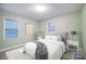 Charming bedroom features a bed with two windows and grey accents at 10031 Bora Bora Dr, Tega Cay, SC 29708