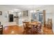 Bright dining room features hardwood floors, round table, and French doors leading to the outdoors at 10031 Bora Bora Dr, Tega Cay, SC 29708
